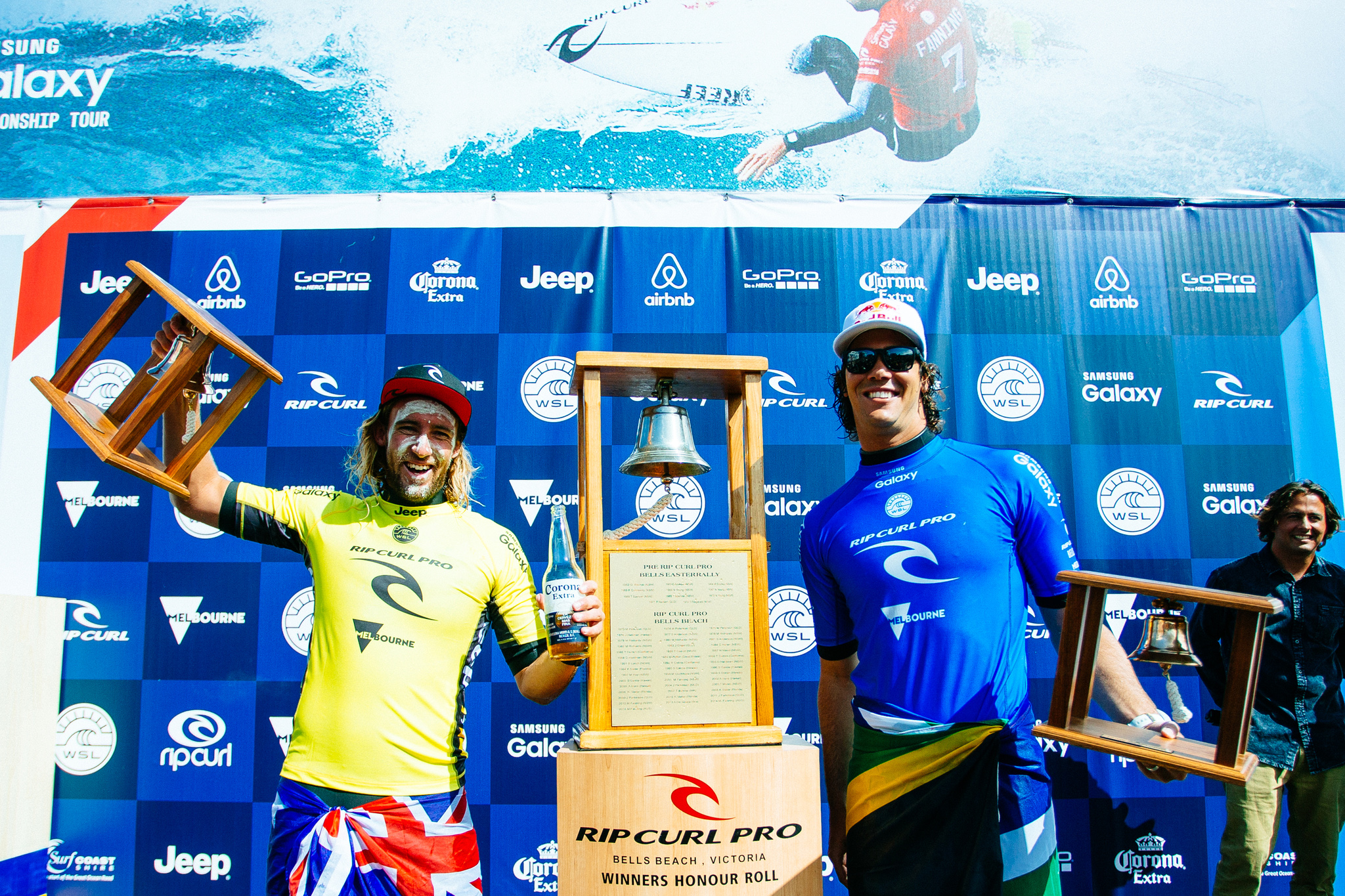 Rip Curl Pro Bells Beach champion Matt Wilkinson of Australia (pictured yellow) and runner up Jordy Smith of South Africa (blue) celebrate during prizegiving at the Rip Curl Pro Bells Beach on Sunday April 3, 2016. Matt Wilkinson of Australia (pictured) hoists his bell after winning the Rip Curl Pro Bells Beach on Sunday April 3, 2016. PHOTO: © WSL/ Sloane SOCIAL: @wsl @edsloanephoto This image is the copyright of the World Surf League and is provided royalty free for editorial use only, in all media now known or hereafter created. No commercial rights granted. Sale or license of the images is prohibited. This image is a factually accurate rendering of what it depicts and has not been modified or augmented except for standard cropping and toning. ALL RIGHTS RESERVED.