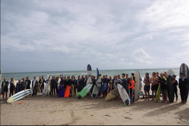 South Coast surfers paddle out in memory of Chris James and raise £1,209 for charity