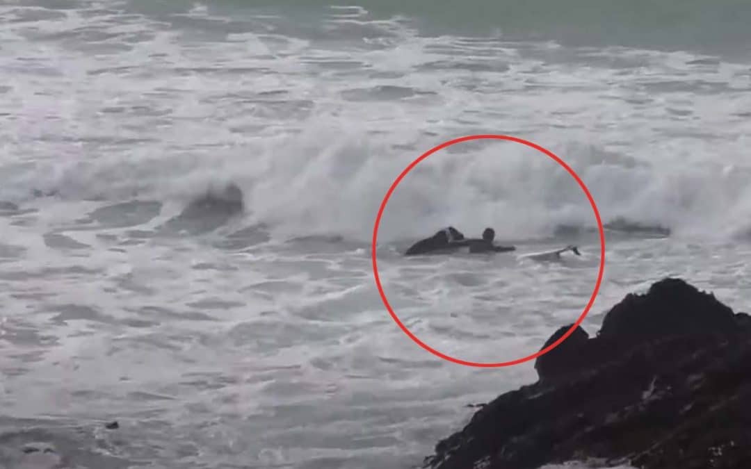 Beginner surfers Fistral rock rescue.