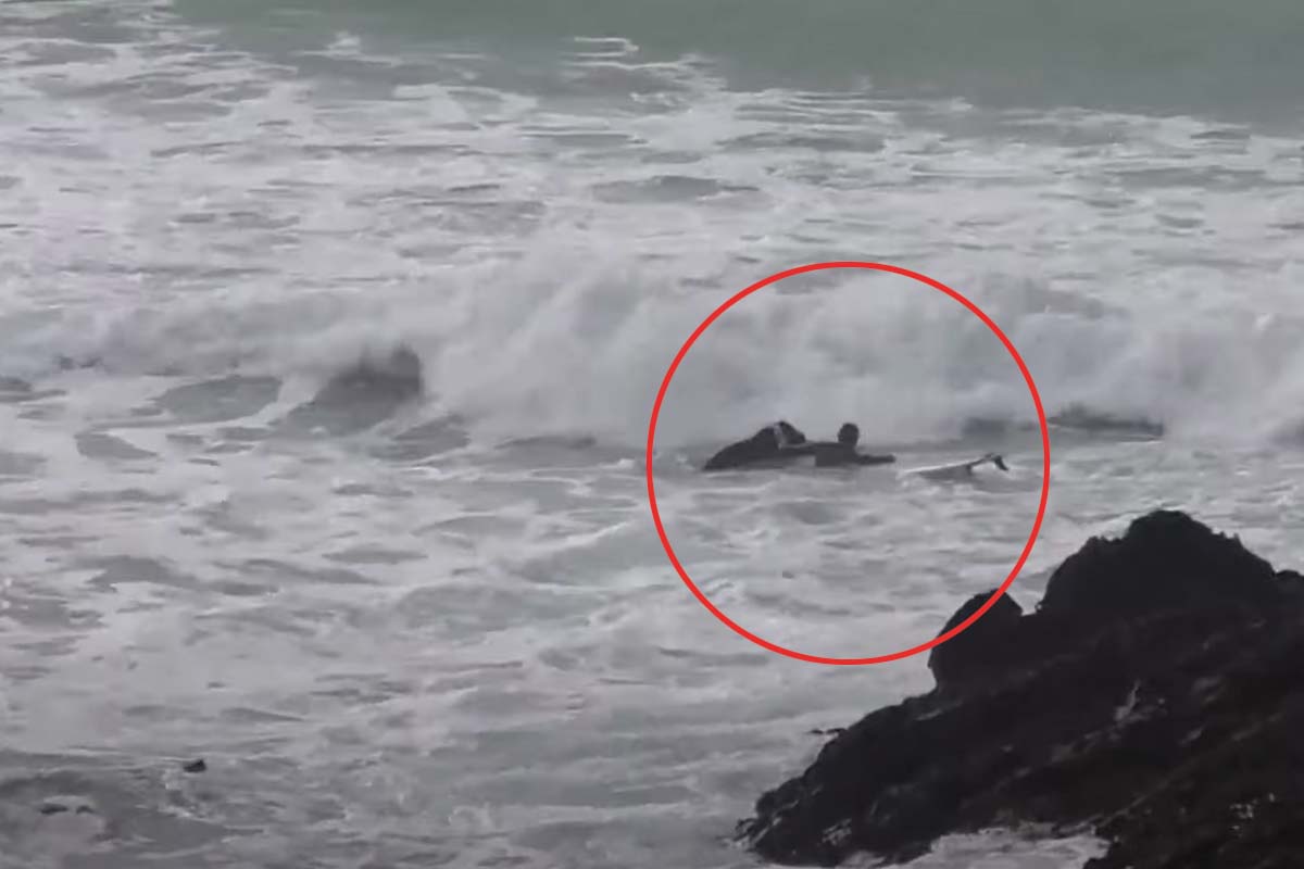 Beginner surfers Fistral rock rescue.
