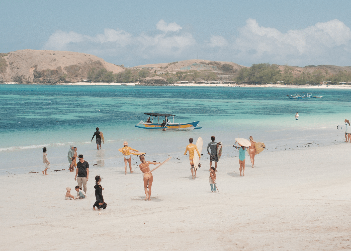 A group walking to the surf boat at Xanadu Surf & Yoga