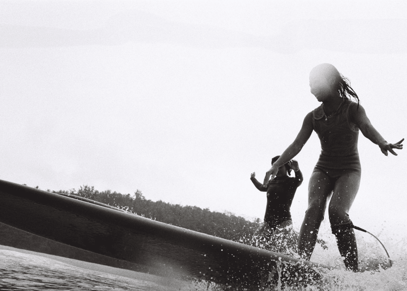A girl surfing at Yume Surfcamps