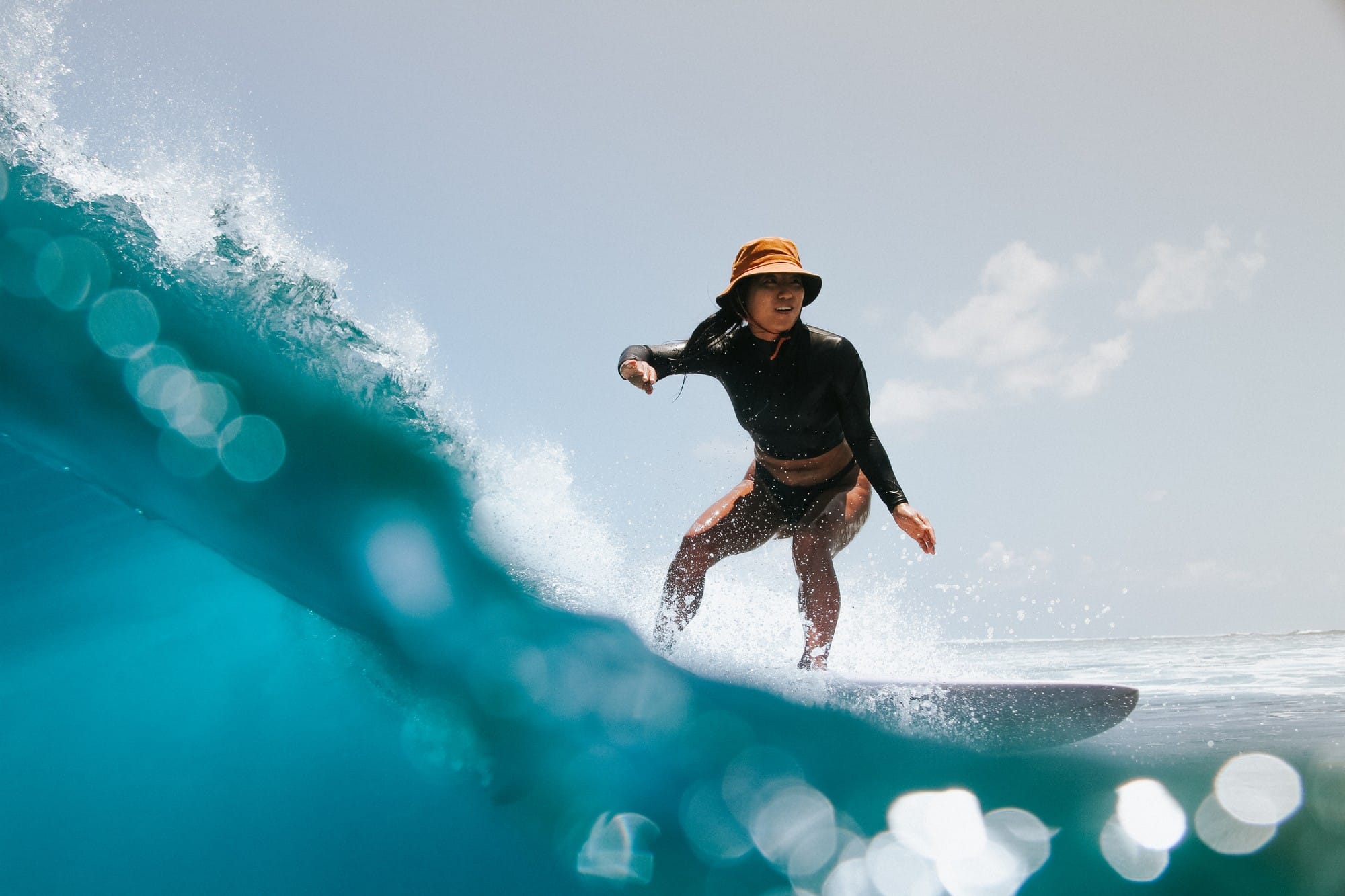 Surfer above and below the water at Renegade