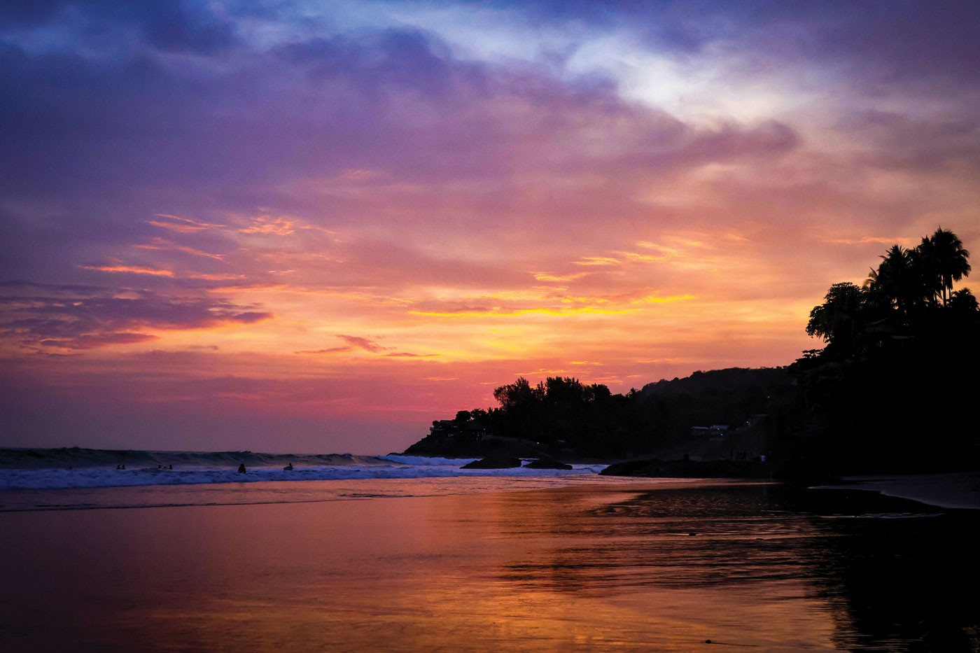 Sunset over the point at El Zonte, El Salvador