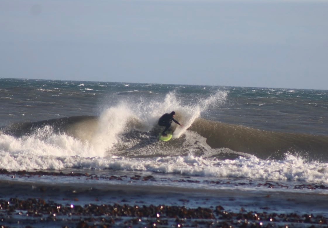 Ed Broadbent surfing