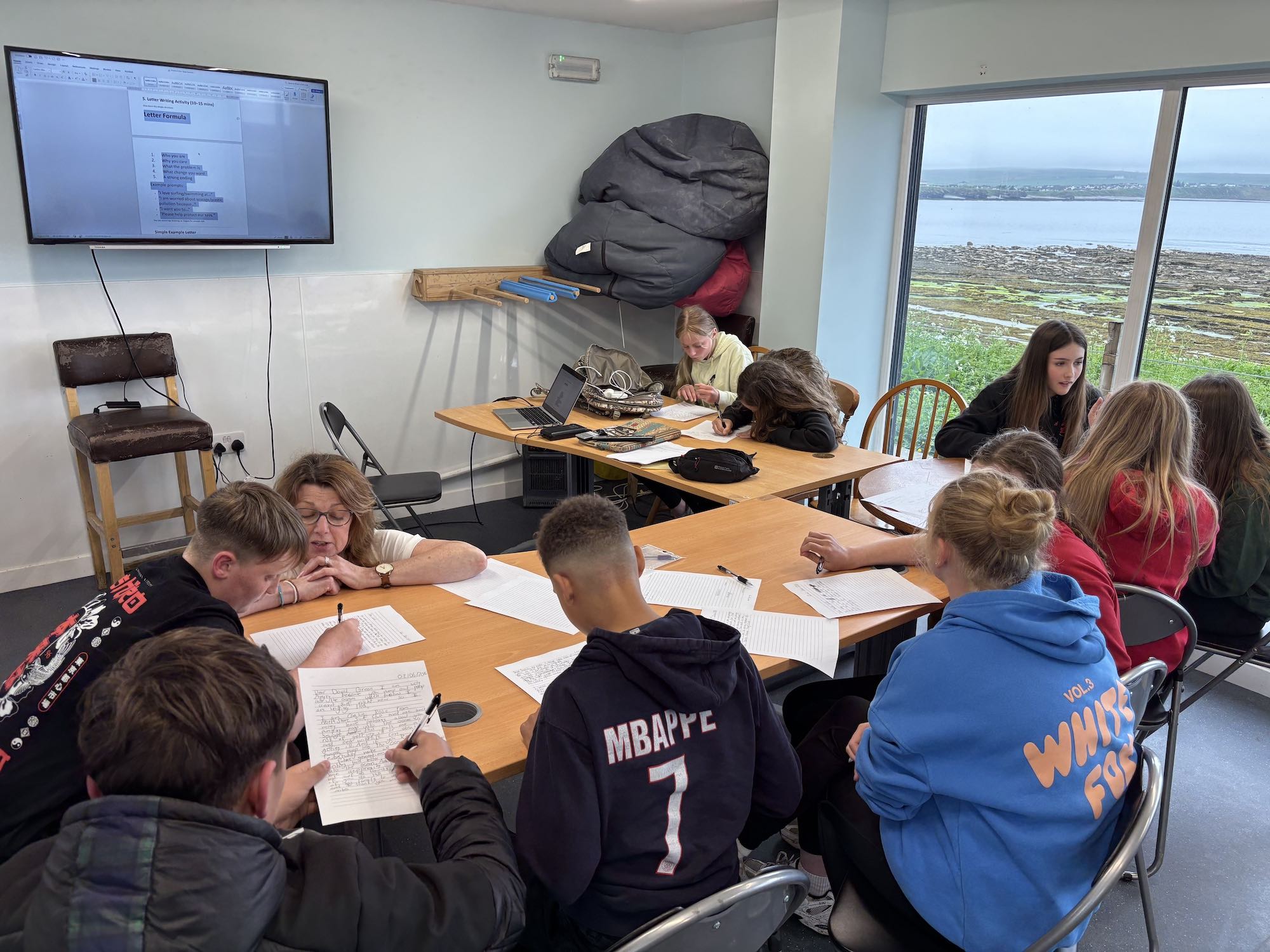 North Shore Surf Club groms writing letters
