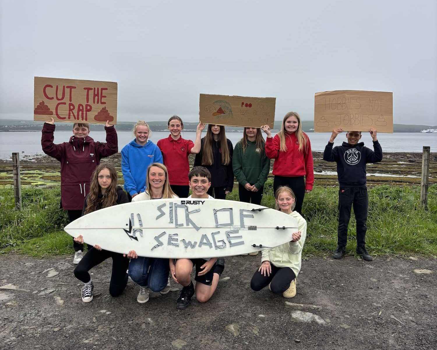 North Shore Surf Club groms protest with surfboards